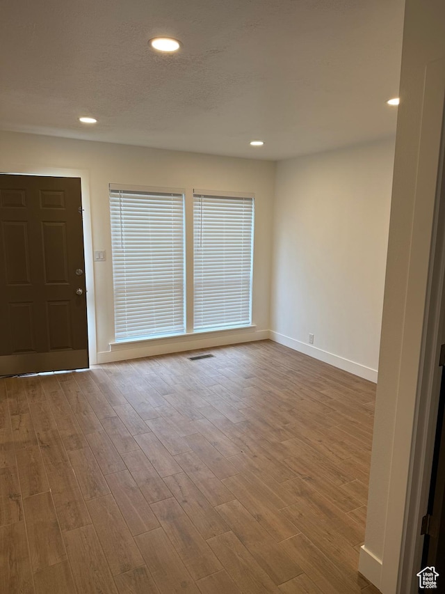 3049 S Orchard Dr Unit B, Bountiful, UT 84010 - spare room with visible vents, baseboards, recessed lighting, and wood finished floors