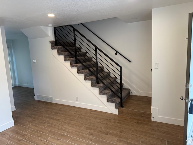3049 S Orchard Dr Unit B, Bountiful, UT 84010 - stairway with visible vents, baseboards, a textured ceiling, and wood finished floors