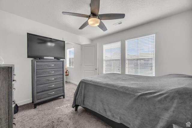 14843 S Beckenbauer Ave, Herriman, UT 84096 - carpeted bedroom featuring visible vents, baseboards, and a textured ceiling