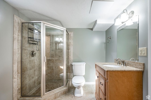 full bathroom with baseboards, toilet, a shower stall, vanity, and tile patterned flooring