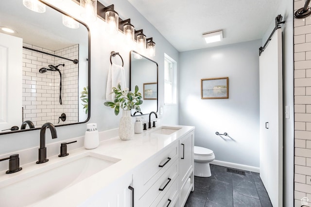 full bathroom featuring toilet, a sink, a tile shower, and visible vents