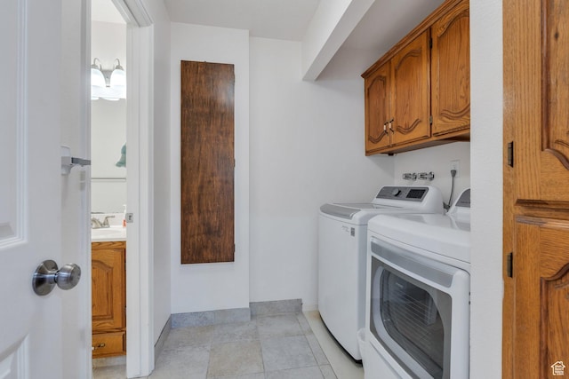 1769 Cobblestone Dr, Provo, UT 84604 - laundry room with washing machine and dryer, cabinet space, and light tile patterned floors
