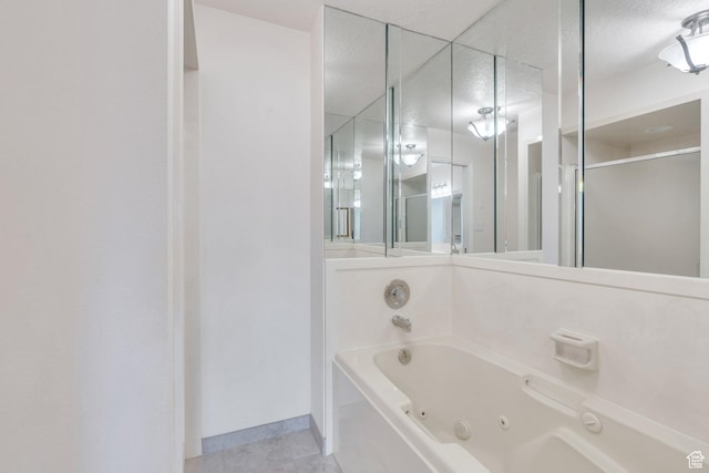 1769 Cobblestone Dr, Provo, UT 84604 - bathroom featuring a tub with jets, a shower stall, and tile patterned flooring