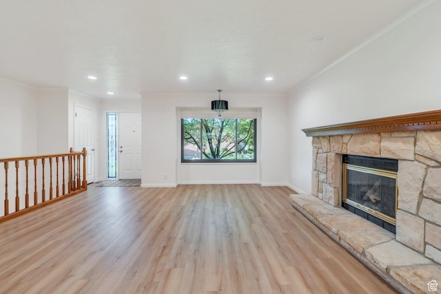 1769 Cobblestone Dr, Provo, UT 84604 - unfurnished living room with crown molding, light wood-type flooring, a fireplace, and recessed lighting