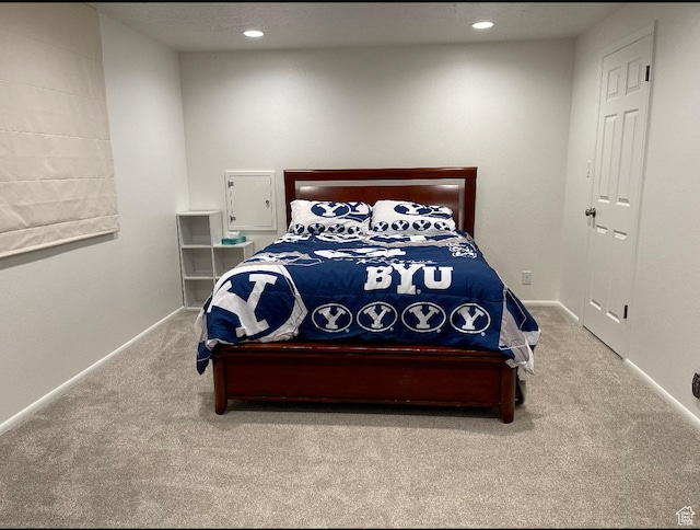 bedroom with recessed lighting, carpet floors, and baseboards
