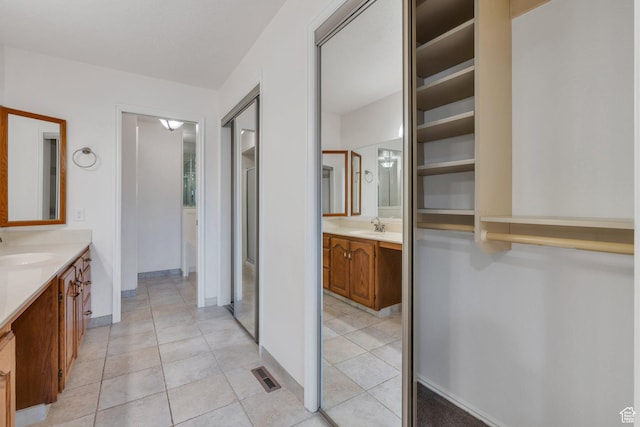 1769 Cobblestone Dr, Provo, UT 84604 - bathroom featuring two vanities and tile patterned flooring