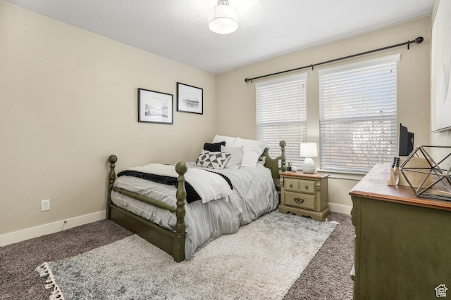 bedroom with baseboards and carpet flooring