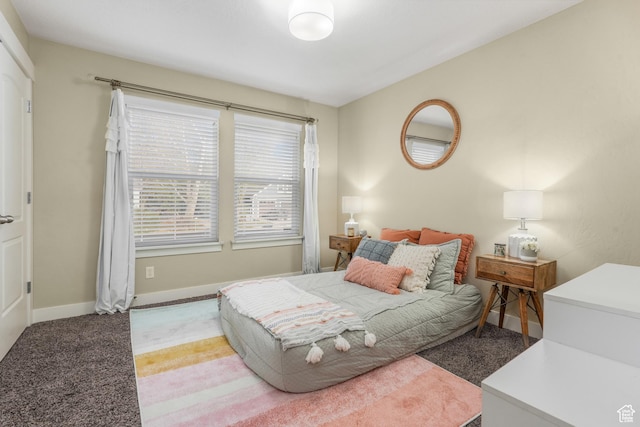carpeted bedroom with baseboards