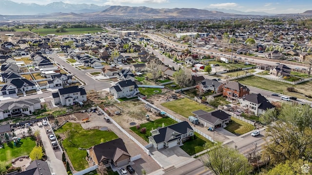 birds eye view of property featuring a mountain view and a residential view