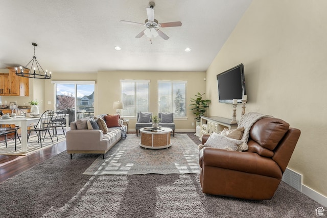 living room with visible vents, baseboards, recessed lighting, ceiling fan with notable chandelier, and lofted ceiling