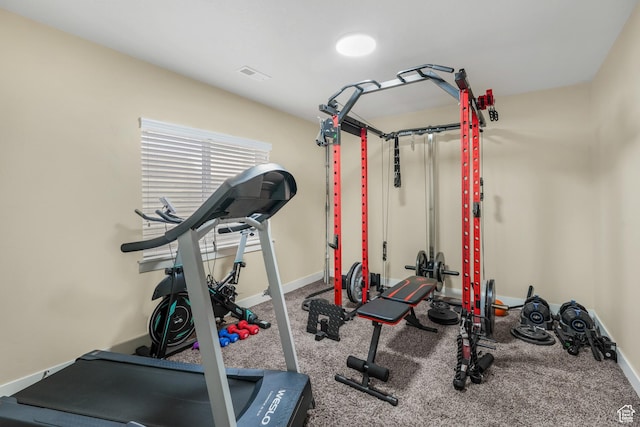 exercise area featuring carpet flooring, baseboards, and visible vents