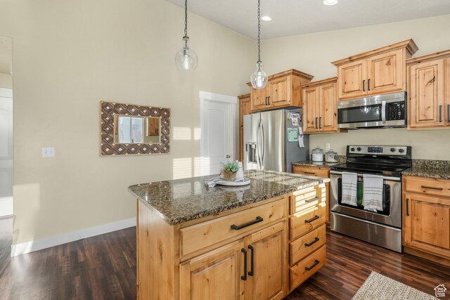 kitchen with appliances with stainless steel finishes, dark wood finished floors, dark stone counters, high vaulted ceiling, and a kitchen island