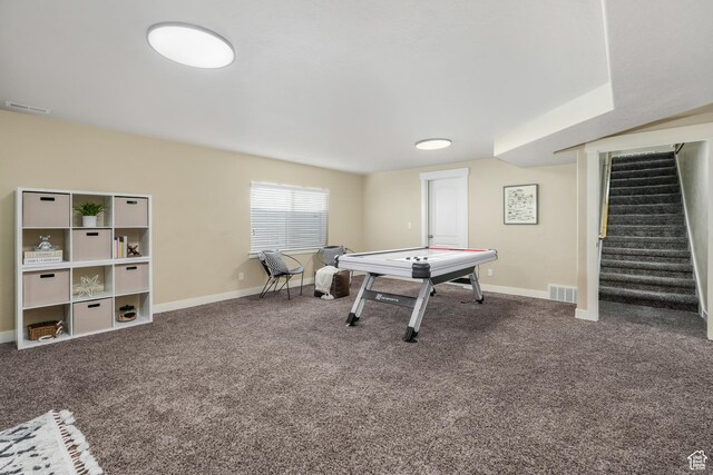 rec room featuring visible vents and carpet floors