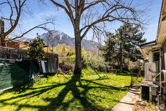 4455 S Aspen Hollow Ln, Holladay, UT 84117 - view of yard featuring a mountain view, fence, and central AC unit