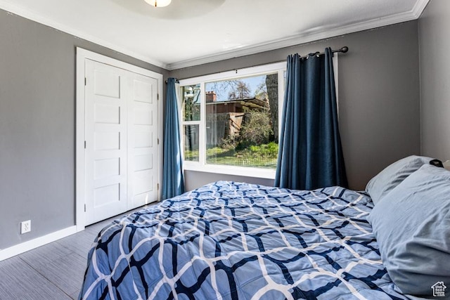 4455 S Aspen Hollow Ln, Holladay, UT 84117 - bedroom featuring crown molding, a closet, baseboards, and wood finished floors