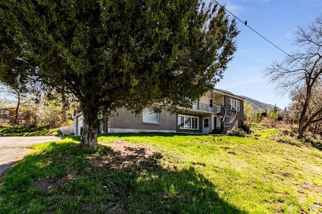 4455 S Aspen Hollow Ln, Holladay, UT 84117 - view of yard with concrete driveway and stairs
