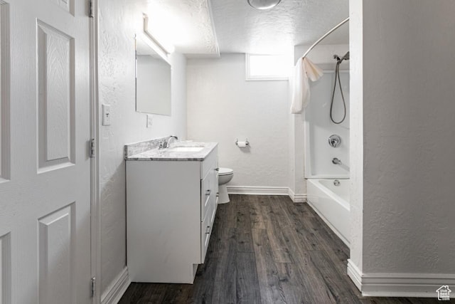 4455 S Aspen Hollow Ln, Holladay, UT 84117 - full bath with washtub / shower combination, a textured wall, a textured ceiling, vanity, and wood finished floors