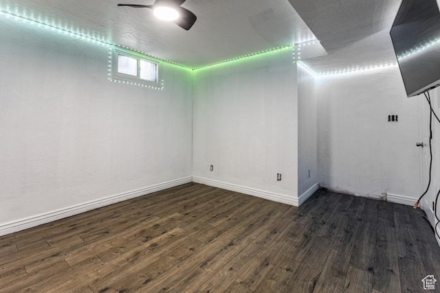 4455 S Aspen Hollow Ln, Holladay, UT 84117 - below grade area featuring dark wood-style floors, baseboards, and ceiling fan