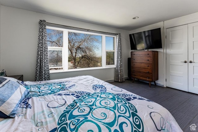 4455 S Aspen Hollow Ln, Holladay, UT 84117 - bedroom featuring a closet, baseboards, and wood finished floors
