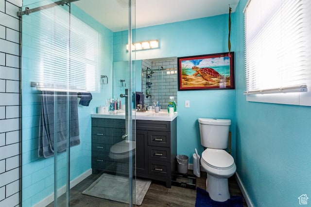 4455 S Aspen Hollow Ln, Holladay, UT 84117 - bathroom featuring toilet, a shower stall, vanity, and wood finished floors
