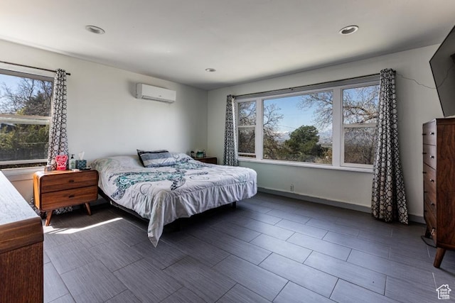 4455 S Aspen Hollow Ln, Holladay, UT 84117 - bedroom with a wall mounted AC, multiple windows, and recessed lighting