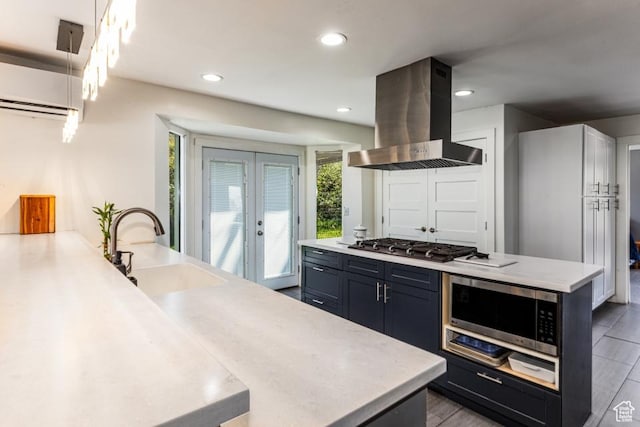 4455 S Aspen Hollow Ln, Holladay, UT 84117 - kitchen with a sink, light countertops, recessed lighting, stainless steel appliances, and island range hood