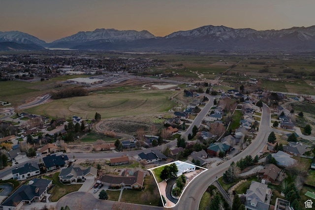 aerial view at dusk with a residential view and a mountain view