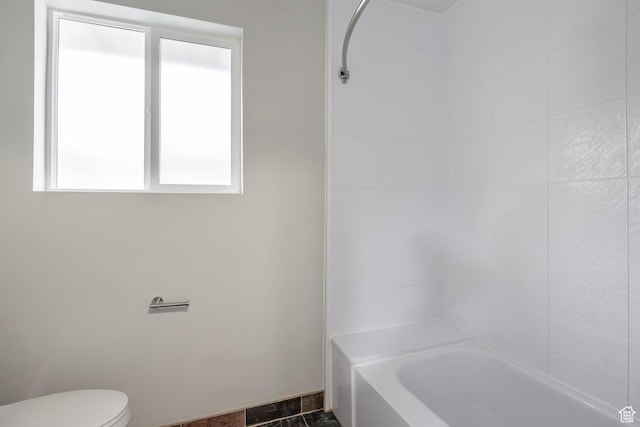 full bath featuring  shower combination and toilet