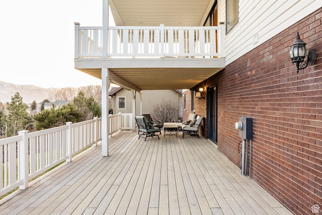 wooden deck featuring a mountain view