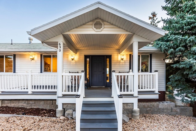 property entrance featuring a porch