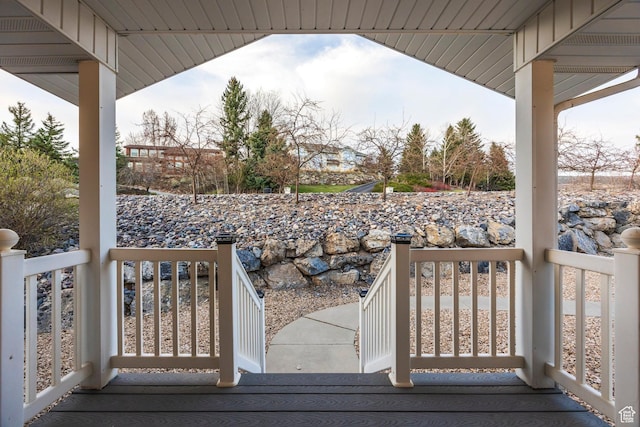 wooden terrace featuring covered porch