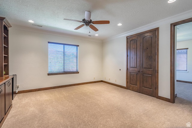 1844 N Wellington St, Washington, UT 84780 - unfurnished bedroom with recessed lighting, baseboards, visible vents, crown molding, and light carpet