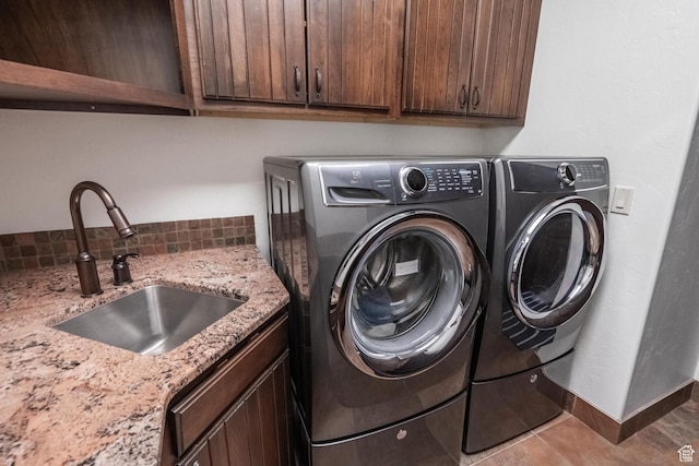 1844 N Wellington St, Washington, UT 84780 - washroom featuring cabinet space, washer and dryer, and a sink