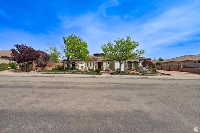 1844 N Wellington St, Washington, UT 84780 - view of front of property featuring stucco siding, a tile roof, and fence