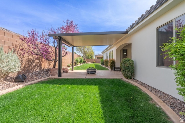 1844 N Wellington St, Washington, UT 84780 - view of yard with an outdoor fire pit, a patio, and a fenced backyard