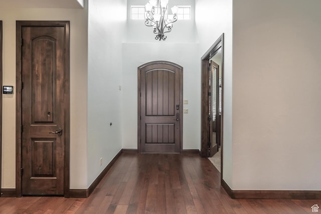 1844 N Wellington St, Washington, UT 84780 - foyer featuring dark wood-type flooring, baseboards, a high ceiling, and a notable chandelier