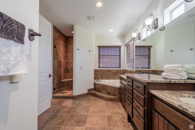 1844 N Wellington St, Washington, UT 84780 - bathroom with a garden tub, vanity, a shower stall, and recessed lighting