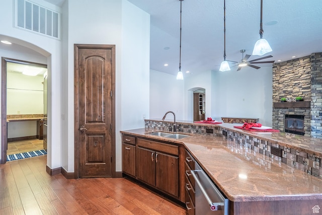 1844 N Wellington St, Washington, UT 84780 - kitchen featuring a sink, visible vents, light wood-style flooring, arched walkways, and a ceiling fan