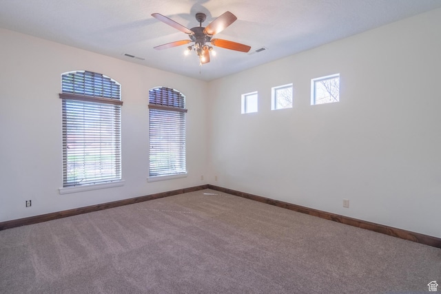 1844 N Wellington St, Washington, UT 84780 - carpeted empty room with baseboards, a ceiling fan, and visible vents