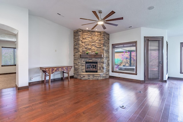 1844 N Wellington St, Washington, UT 84780 - unfurnished living room featuring a fireplace, a healthy amount of sunlight, a ceiling fan, and visible vents