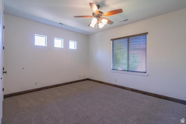 1844 N Wellington St, Washington, UT 84780 - unfurnished room featuring ceiling fan, carpet flooring, baseboards, and visible vents