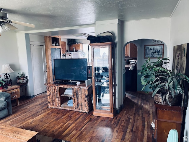 4270 W 2000 N, Malad City, ID 83252 - living room with arched walkways, a textured ceiling, hardwood / wood-style floors, and a ceiling fan