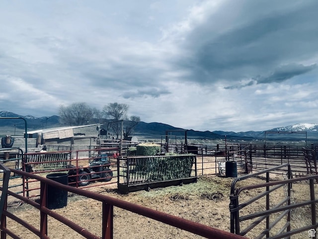 4270 W 2000 N, Malad City, ID 83252 - view of yard featuring a rural view, an outbuilding, a mountain view, and an exterior structure