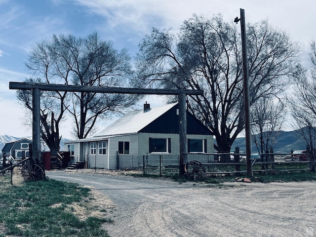 4270 W 2000 N, Malad City, ID 83252 - exterior space featuring metal roof, fence, and a chimney