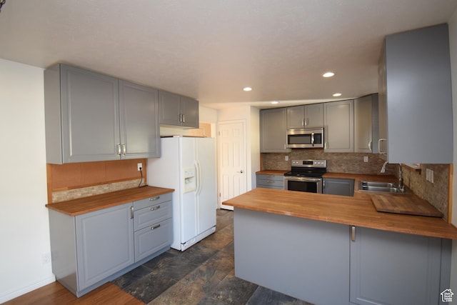 9111 S Parakeet Dr, Sandy, UT 84093 - kitchen with a sink, gray cabinets, wooden counters, and stainless steel appliances