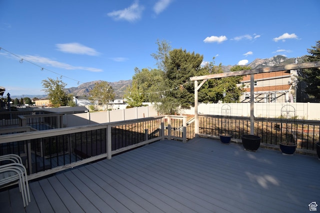 9111 S Parakeet Dr, Sandy, UT 84093 - wooden deck featuring a fenced backyard and a mountain view