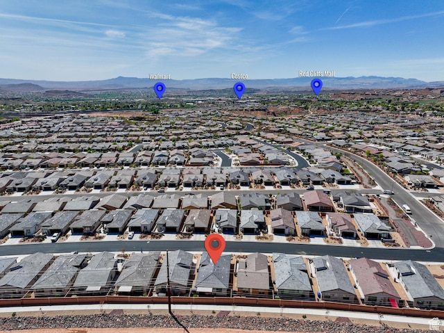 drone / aerial view featuring a mountain view and a residential view