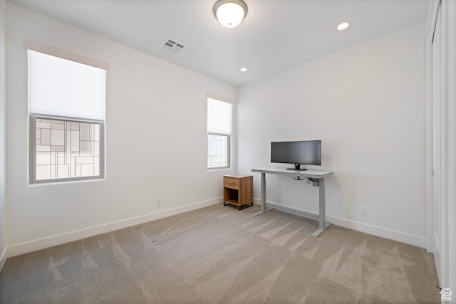 unfurnished office with recessed lighting, visible vents, baseboards, and light colored carpet