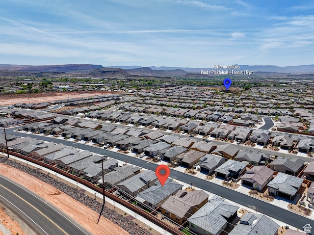 birds eye view of property featuring a mountain view and a residential view