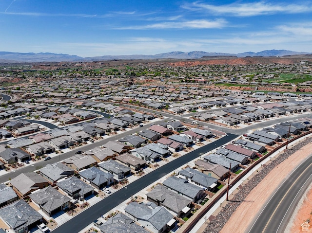birds eye view of property featuring a mountain view and a residential view